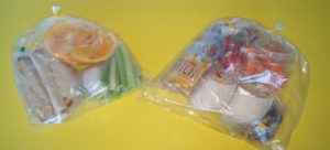 Sack lunches sealed by bag sealer